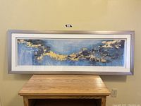 Full view of the framed abstract art print showing dimensions and framing style.