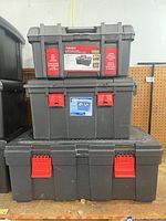 Three bins stacked showing overall lot: top Husky, middle Sterilite, bottom GSC.