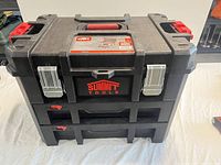 Front view of black Summit Tools 2 drawer interlocking tool chest with red handles and silver latches.