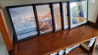 Five framed wall art pieces shown lined up on a shelf, each approx 8x8 inches, featuring various landscape and nature images.