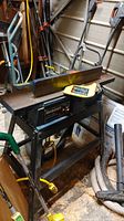 Front angled view of jointer/planer with fence and cutter head