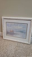 Framed lithographic print by Lucie Bilodeau leaning against a wall showing full artwork and frame.