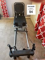 Front view of the AeroPilates reformer showing padded platform, rebounder section and foot bar.