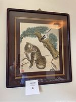 Framed vintage Korean painting of a tiger sitting on rocky terrain with a magpie perched on a pine tree branch.