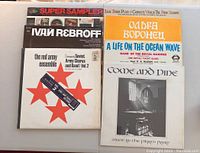 Photo showing seven LP record covers arranged in two rows including 'Super Sampler', 'Ivan Rebroff', 'The Red Army Ensemble Vol. 2', and others with classical and choral themes.