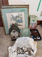 Overview of the lot showing framed prints, wooden birdhouses, ornament box, gift boxes, rain catcher and coasters.