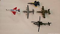 Top-down view of all five aircraft models arranged showing variety and size differences.
