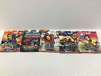 Five Hot Wheels Masters of the Universe die cast cars in original packaging shown front view