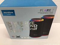 Front view of the Soundcore Flare 2 box showing brand, model, and features including immersive 360° sound and waterproof speaker designation.