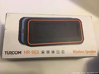 Front of the box showing Turcom HR-903 wireless speaker image and branding