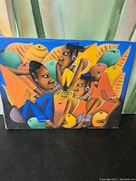 Full frontal image of abstract canvas artwork showing three figures in vibrant colors and pineapple motif in the center.