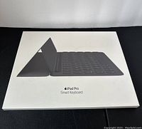 Front view of the unopened retail box showing the Apple iPad Pro Smart Keyboard image and branding.