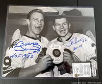 Full front view of signed photograph showing both players and signatures