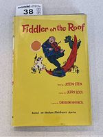 Front cover of dust-jacketed book showing title, artwork, and overall condition