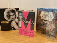 All three books arranged side by side on table