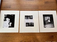 Wide shot of three of the four matted photos laid out on wood surface