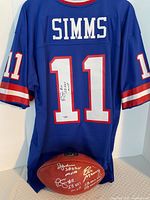 Rear view of signed jersey draped over football