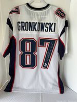 Full back view of white #87 Gronkowski jersey showing name and number