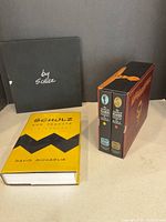 Overview of the signed biography and two-volume Complete Peanuts set in slipcase