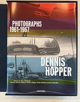 Front cover of dust jacket showing title 'Photographs 1961-1967 Dennis Hopper' with color bands