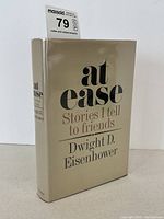 Front and spine of book in dust jacket on table, showing overall condition