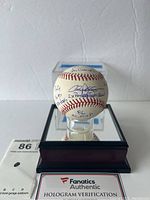 Front view of autographed baseball in display case with Fanatics Authentic hologram card