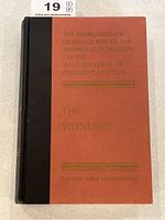 Front cover showing red boards, black cloth spine with gilt lettering