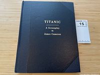 Front cover showing black simulated leather boards with gold foil title text