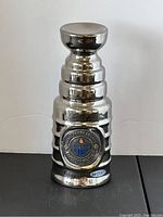 Full front view of silver-tone miniature Stanley Cup replica