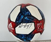 Front view showing autograph on white panel and adidas logo