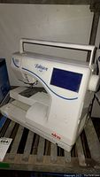 Front view showing handle, LCD screen and work area