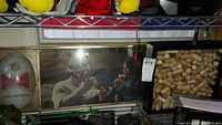 Photo showing the Budweiser sign with a man and woman toasting, and the wine corks in a display case to the right.