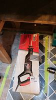 Jobmate reciprocating saw in original box showing saw image and key features