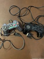 Both controllers laid out side by side showing full wired length and controllers.