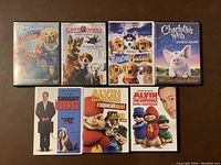 Top row of DVD cases showing titles and cover artwork for 8 animal-themed movies.
