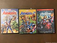 Front covers of three DVD cases: Ultimate Avengers The Movie, Ultimate Avengers 2, and Marvel's The Avengers live-action.