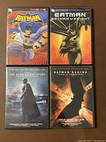 Front covers of four Batman DVDs showing animated series and live-action films