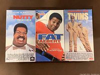 Front cover of three VHS tapes: The Nutty Professor, Fat Albert, Twins