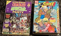 Photo of Extra-Special Cracked Monster Party magazine and Marvel X-Force comic book showing front covers