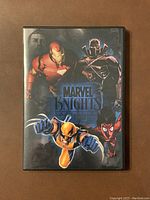 Front cover of the Marvel Knights DVD collection case showing Iron Man, Black Panther, Wolverine, and Spider-Man illustrations.