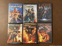 Front covers of six Marvel movie DVDs: Fantastic Four, Thor The Dark World, Thor, Captain America The First Avenger, Ghost Rider, and Ghost Rider Spirit of Vengeance.