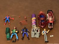 Overview of Spider-Man figures, vehicles, and accessories laid out for display.