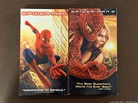 Front view of Spider-Man 1 and Spider-Man 2 VHS cases side by side