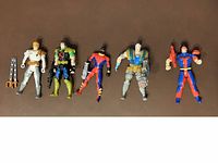 Five X-Force action figures displayed in a single row with neutral background showing full body and accessories.