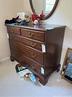 Front left perspective showing overall shape, top surface with items