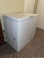 Exterior view of white chest freezer showing overall condition and design