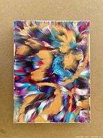 Front view of an original abstract acrylic painting with gold, blue, purple, magenta, and white colors on gallery-wrapped canvas, 12x16 inches.