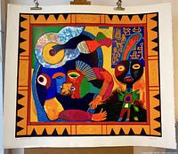 Full view of the silkscreen print with abstract faces and decorative border