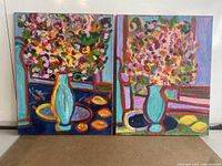 Two oil paintings side by side depicting colorful flower arrangements in blue vases with abstract backgrounds, showing the full diptych set