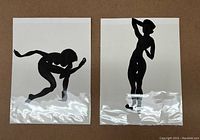 Pair of two black ink life drawings on white Arches paper, each individually photographed in protective plastic covers, showing silhouettes of human figures in different poses.